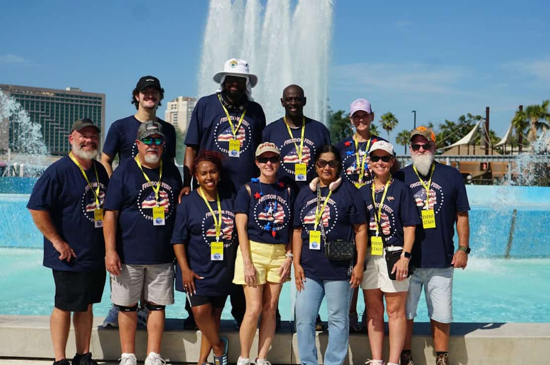 Freedom Fest staff in front of friendship fountain